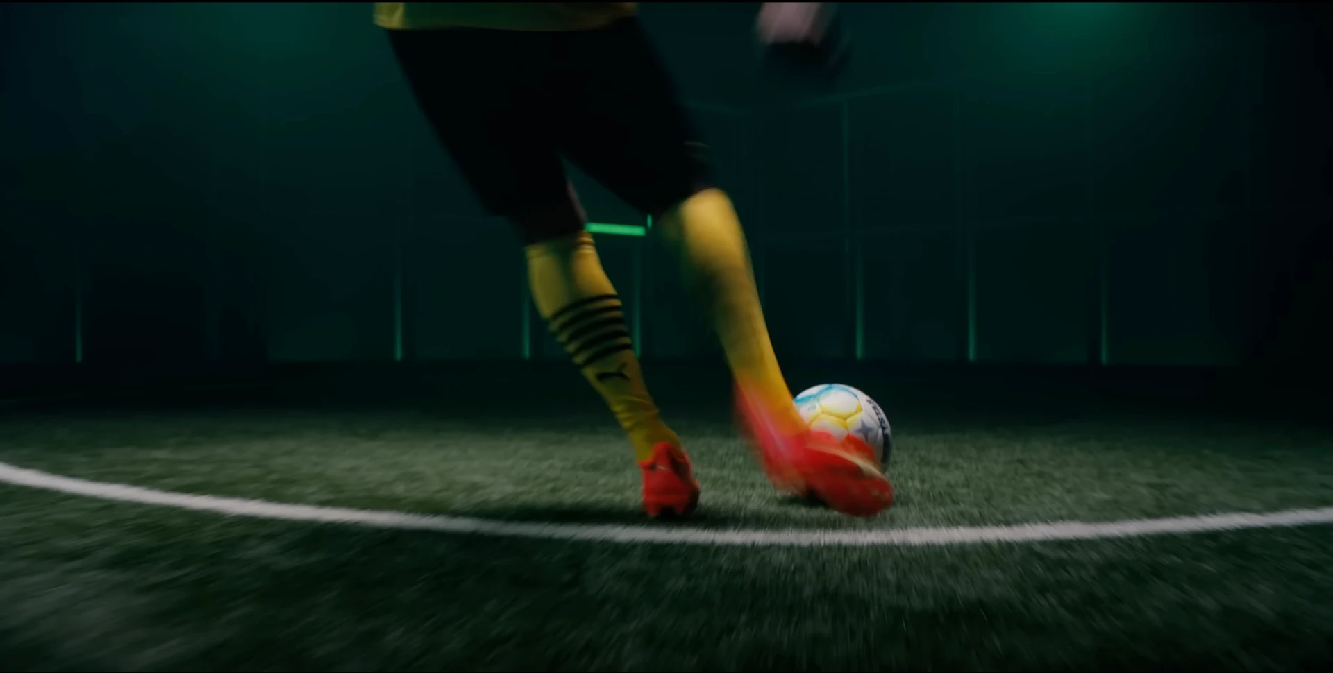 football player kicking a ball